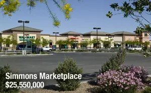 A shopping center with lots of parking spaces.