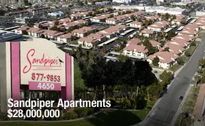 A large apartment complex with many buildings in the background.