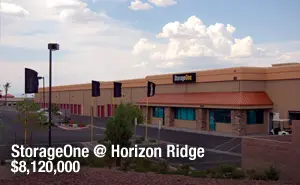 A large building with some clouds in the sky